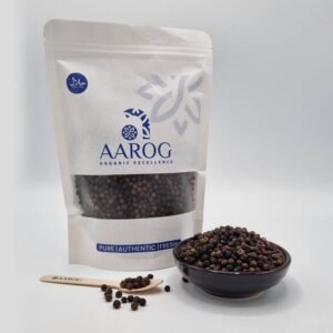 Aarog Whole Black Peppercorns Sabut Kali Mirch in 100g pouch next to a bowl of large, potent peppercorns