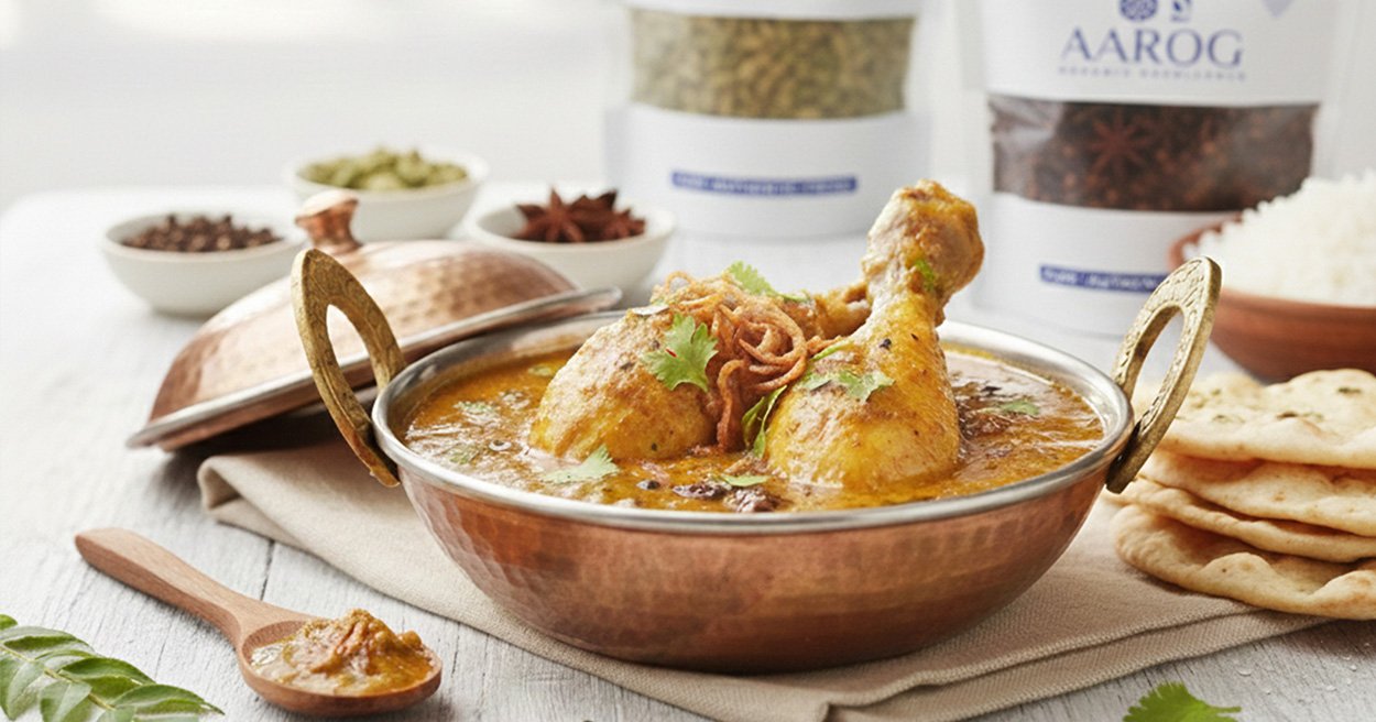 Aarog's Royal Quorma chicken and pack A person enjoying a perfect bowl of rich, Authentic Quorma Masala curry with naan