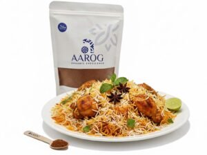 Aarog's Delicious Biryani Recipe: Master the Authentic Meat Delight A stunning, steaming plate of layered Chicken/Beef Biryani, garnished with mint, next to a pouch of Aarog Biryani Masala.